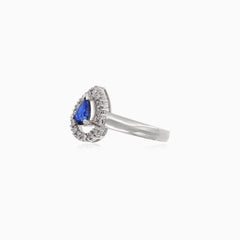 Stunning round diamond and pear sapphire ring