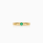 Simple gold ring with small emerald