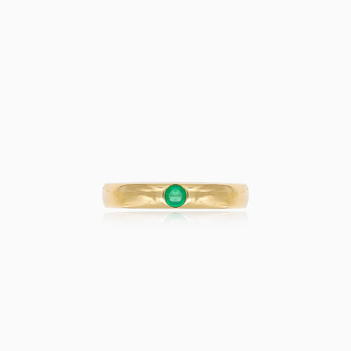 Simple gold ring with small emerald