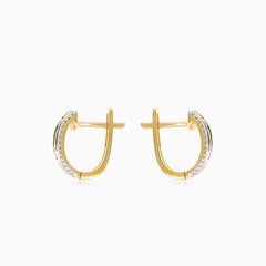 Důmyslné náušnice ze žlutého zlata s kulatým diamantem a smaragdem