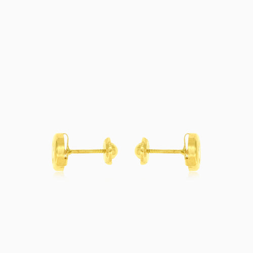Boucles d'oreilles clous en or avec serti.