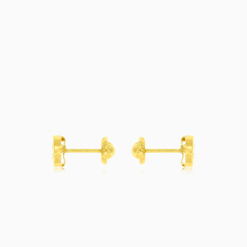 Boucles d'oreilles rondes en or jaune avec zircon cubique brillant.