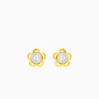 Gold earrings with an engraved flower outline and a white round pearl