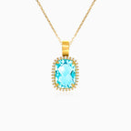 Přívěsek ze žlutého zlata s modrým topazem broušeným do polštářku