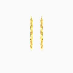 Yellow gold twist polished hoop earring