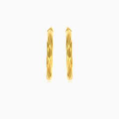 Twisted tube hoop earrings in yellow gold