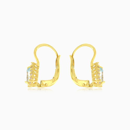 Náušnice s modrým topazem broušeného do hrušky ve žlutém zlatě