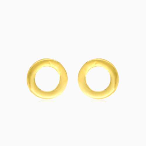 Boucles d'oreilles puces rondes en or jaune avec zircon cubique dans un cadre.