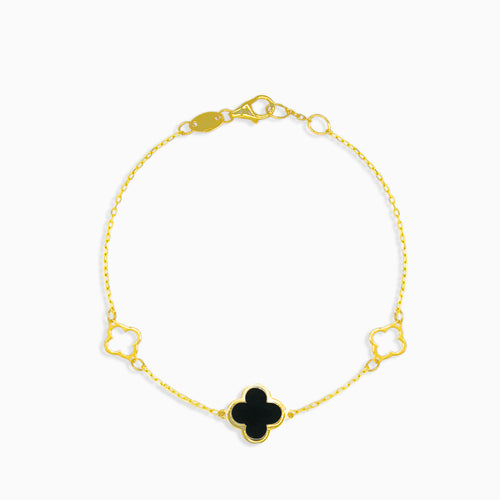 Gold bracelet with black onyx clover leaf