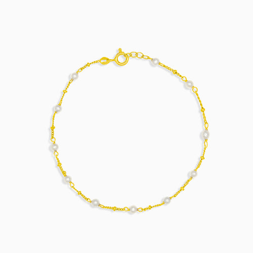 Zlatý náramek s jedenácti perlami