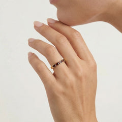 Long channel set garnet gold ring