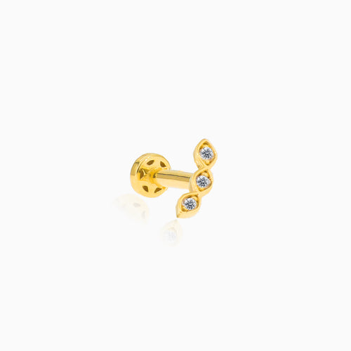 Piercing en or avec trois zircones.
