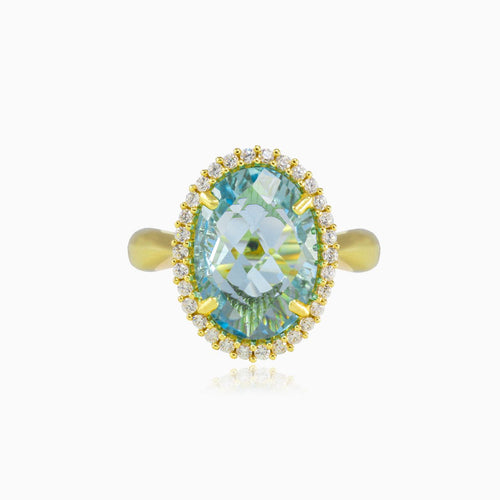Bague massive ovale en or avec topaze bleue