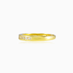 Thin channel-set cubic zirconia gold band